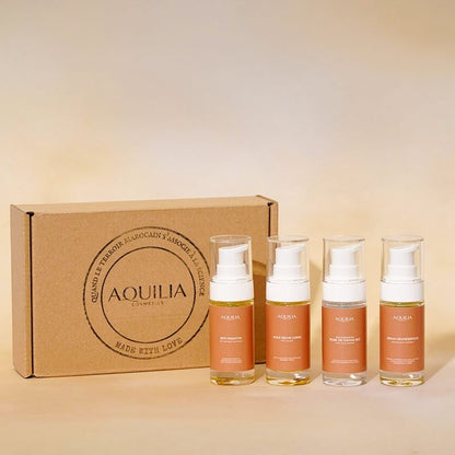 Coffret découverte Aquilia Cosmetics : 4 flacons de sérums et huiles pour le corps et le visage, emballage cartonné.